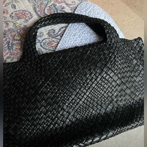 Genuine leather woven handbag made in Italy.